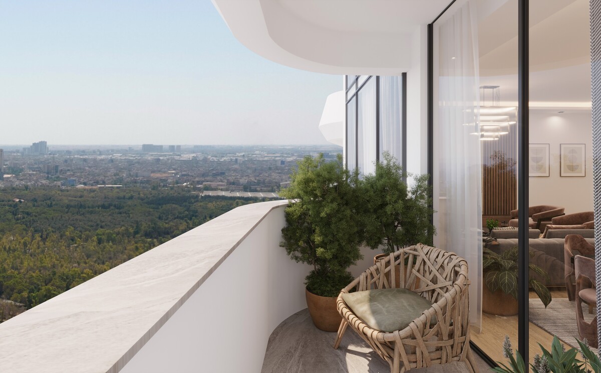 Private balcony at Tulip Towers overlooking the city skyline and surrounding greenery. The image showcases the seamless connection between indoor and outdoor living, featuring modern architecture, landscaped planting, and panoramic views.
