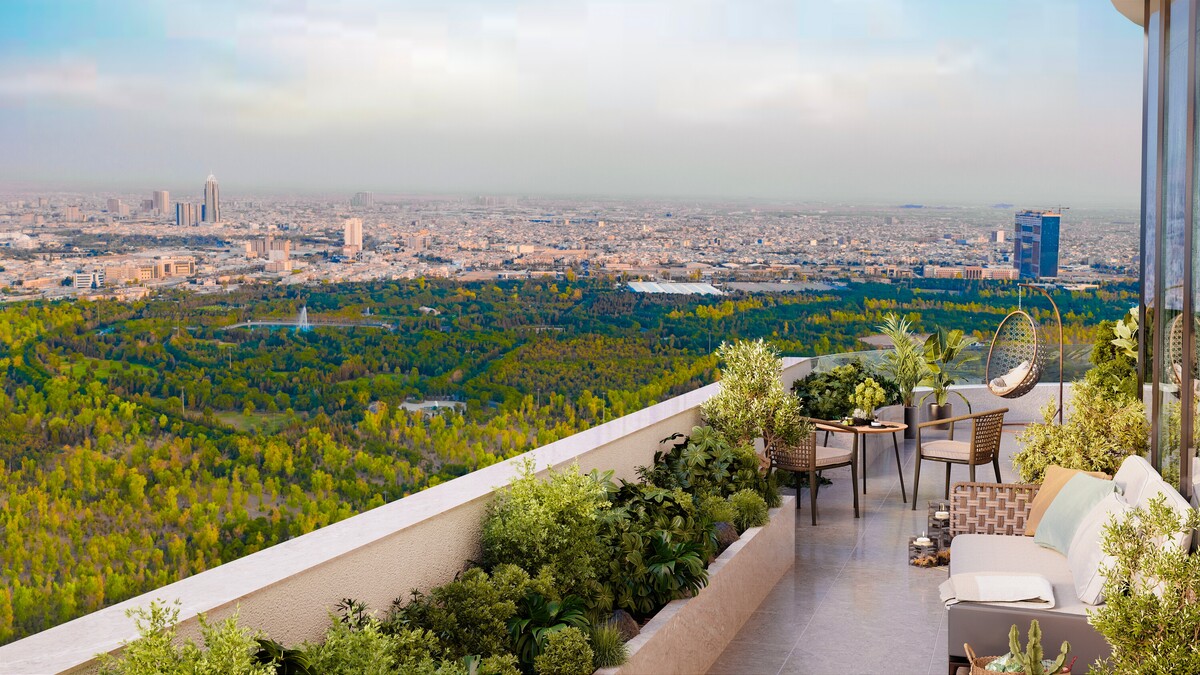 Spacious terrace at Tulip Towers overlooking a large urban park and the city skyline. The image highlights landscaped outdoor living spaces, premium residential amenities, and expansive panoramic views.
