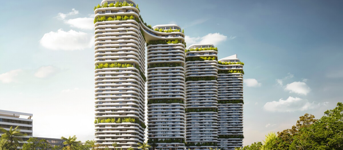 Front view of the Tulip Towers residential development featuring four high-rise buildings with flowing balconies, rooftop gardens, and lush landscaping. The image showcases the project’s iconic architecture and premium urban living concept.